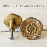 Pair of Antique Gold Floral Metal Knobs with an embossed flower design and aged gold finish, perfect for vintage and French country furniture.