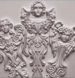 Close-up of the IOD Angelic Tapers Mould featuring intricate angel designs, including beautifully detailed wings and flowing elements, perfect for crafting and decor projects.