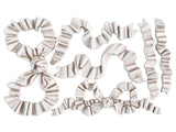 Finished castings from the Bows IOD Décor Mould displaying detailed ribbon and bow designs with realistic folds, perfect for elegant decor, furniture embellishments, or craft projects.