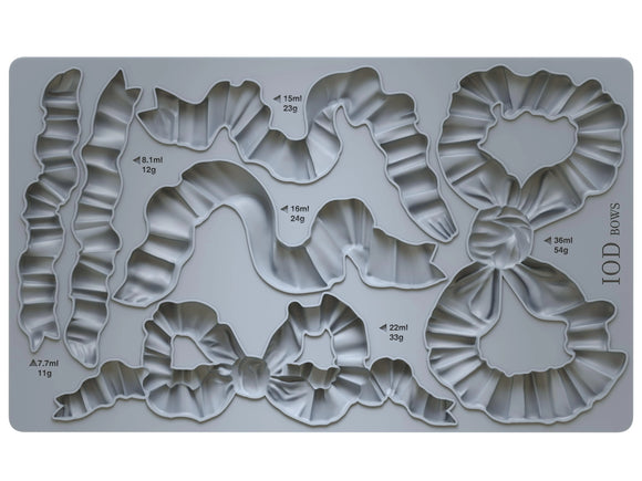 Close-up of the Bows IOD Décor Mould showcasing intricate bow and ribbon designs with detailed folds, perfect for creating elegant furniture appliqués, decor accents, and craft embellishments.