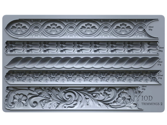 Close-up of the Trimmings 2 IOD Décor Mould showcasing intricate floral, rope, and scroll designs, perfect for crafting elegant DIY projects and furniture accents.